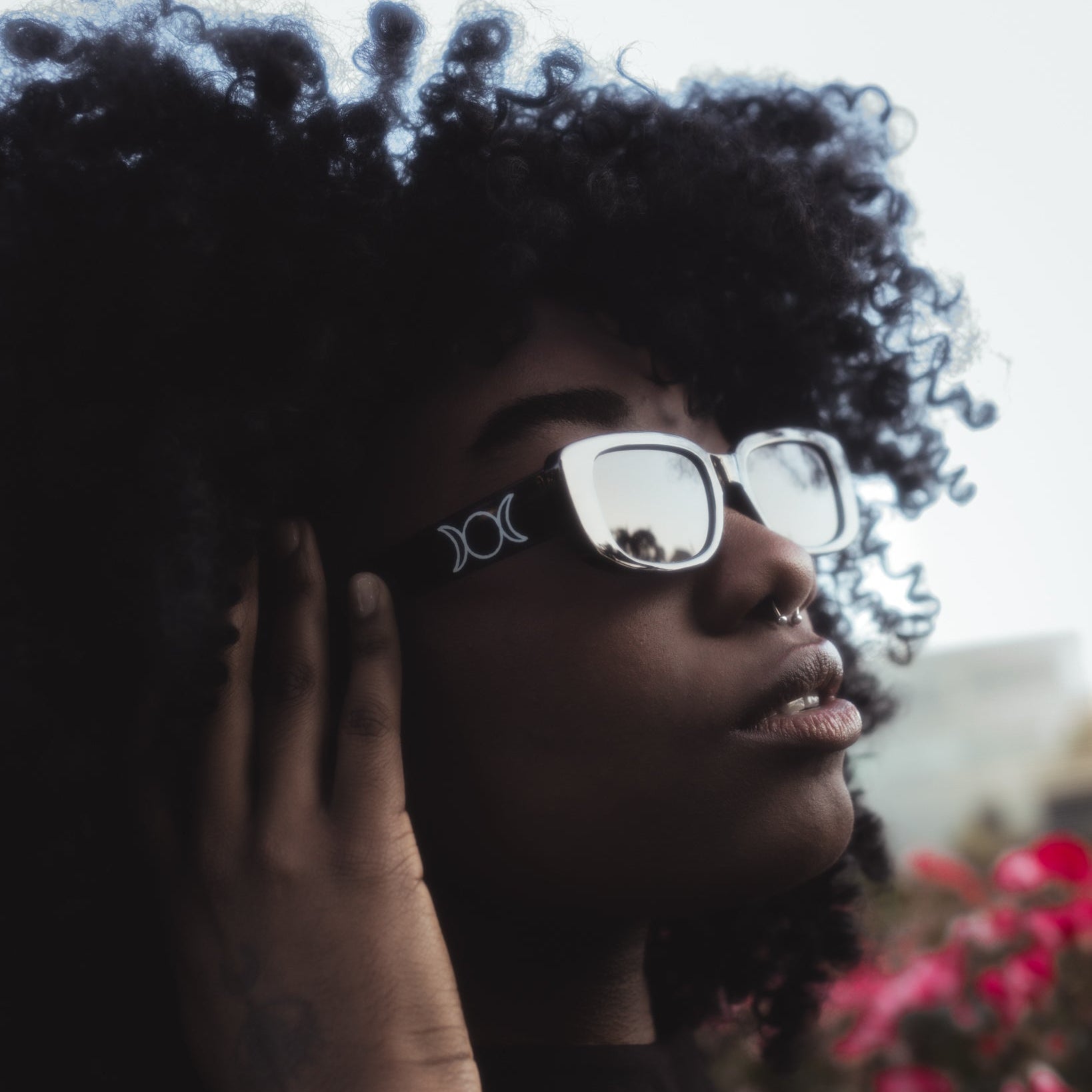 Person wearing glasses with a blurred background