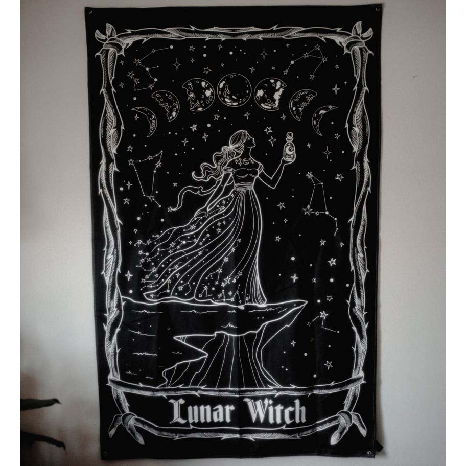 Black tapestry with white design of a woman labeled 'Lunar Witch' against a plain background