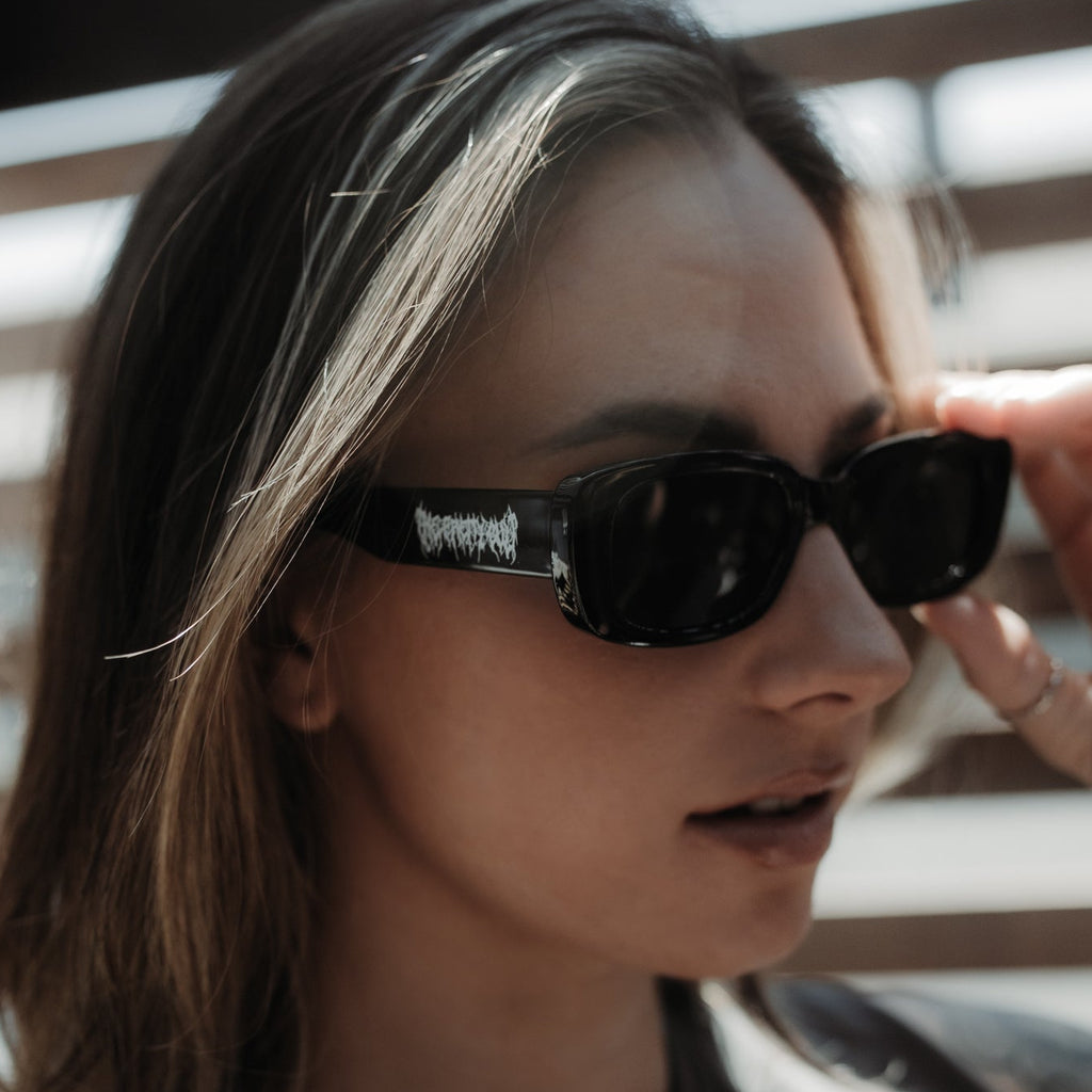 Person wearing sunglasses with a blurred background