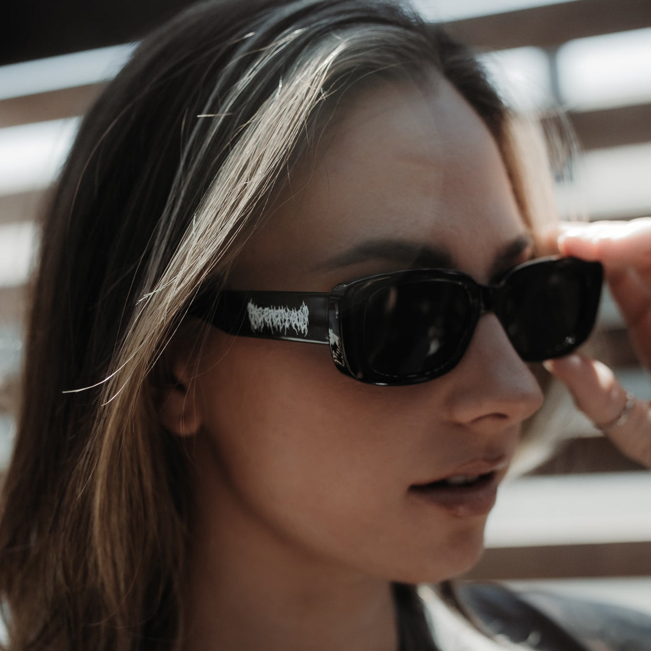 Person wearing sunglasses with a blurred background