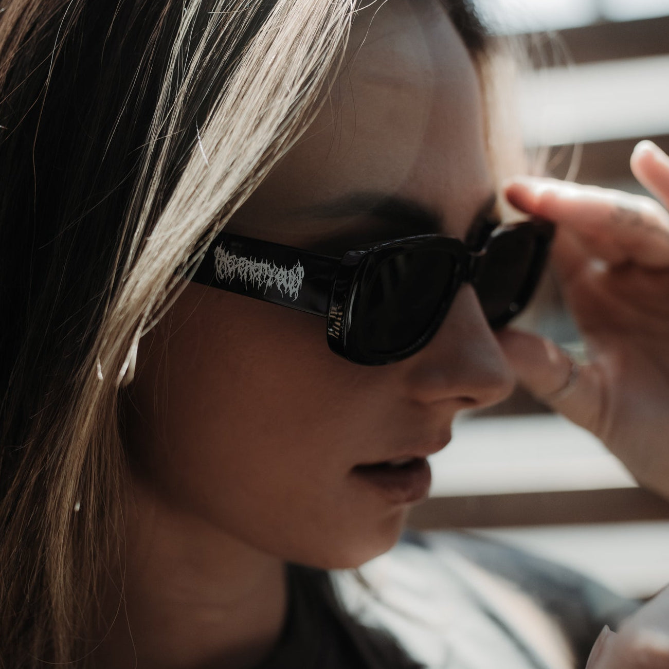 Person wearing sunglasses with a blurred background