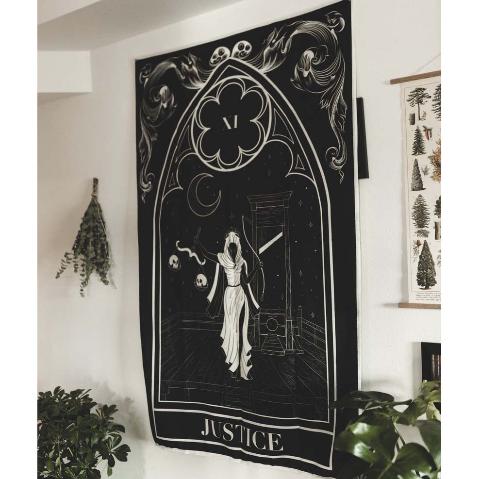 Decorative tapestry with 'Justice' design on a wall