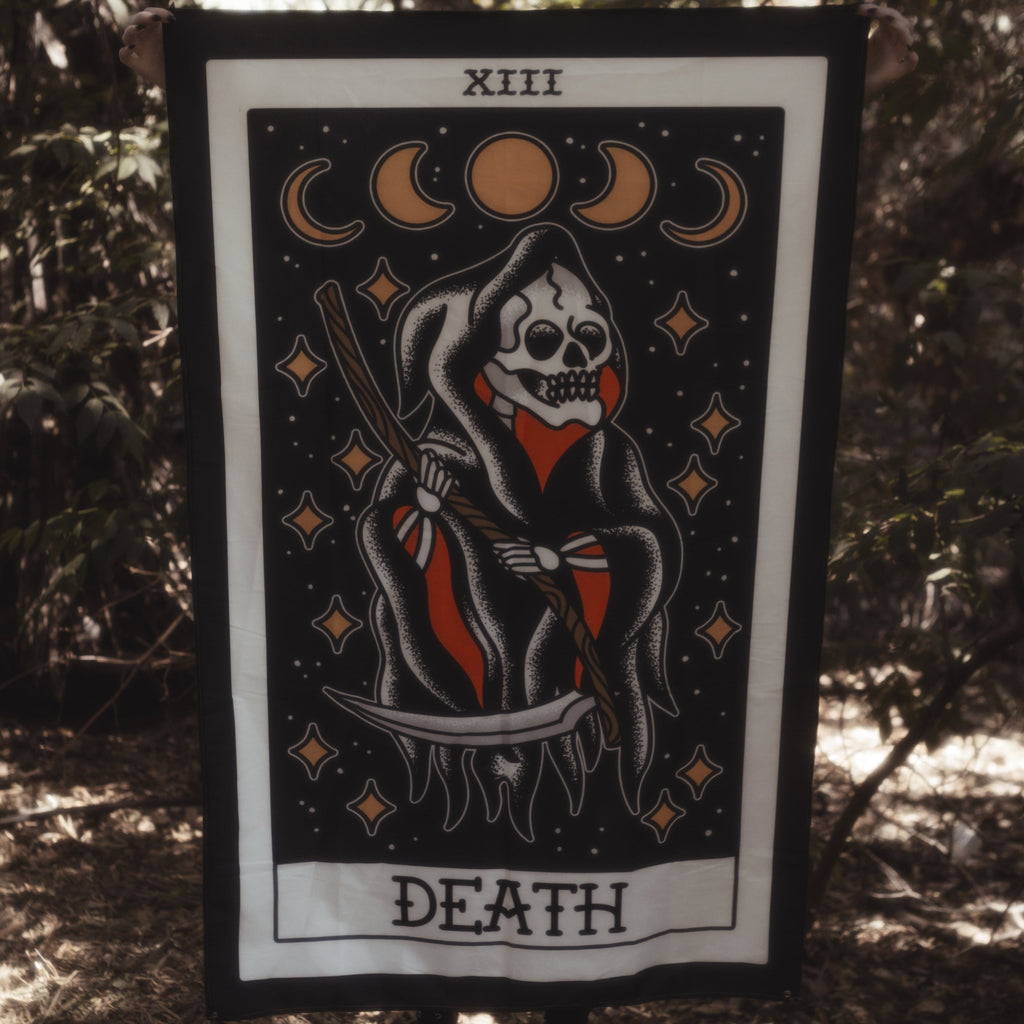 Death Tarot card tapestry being held up