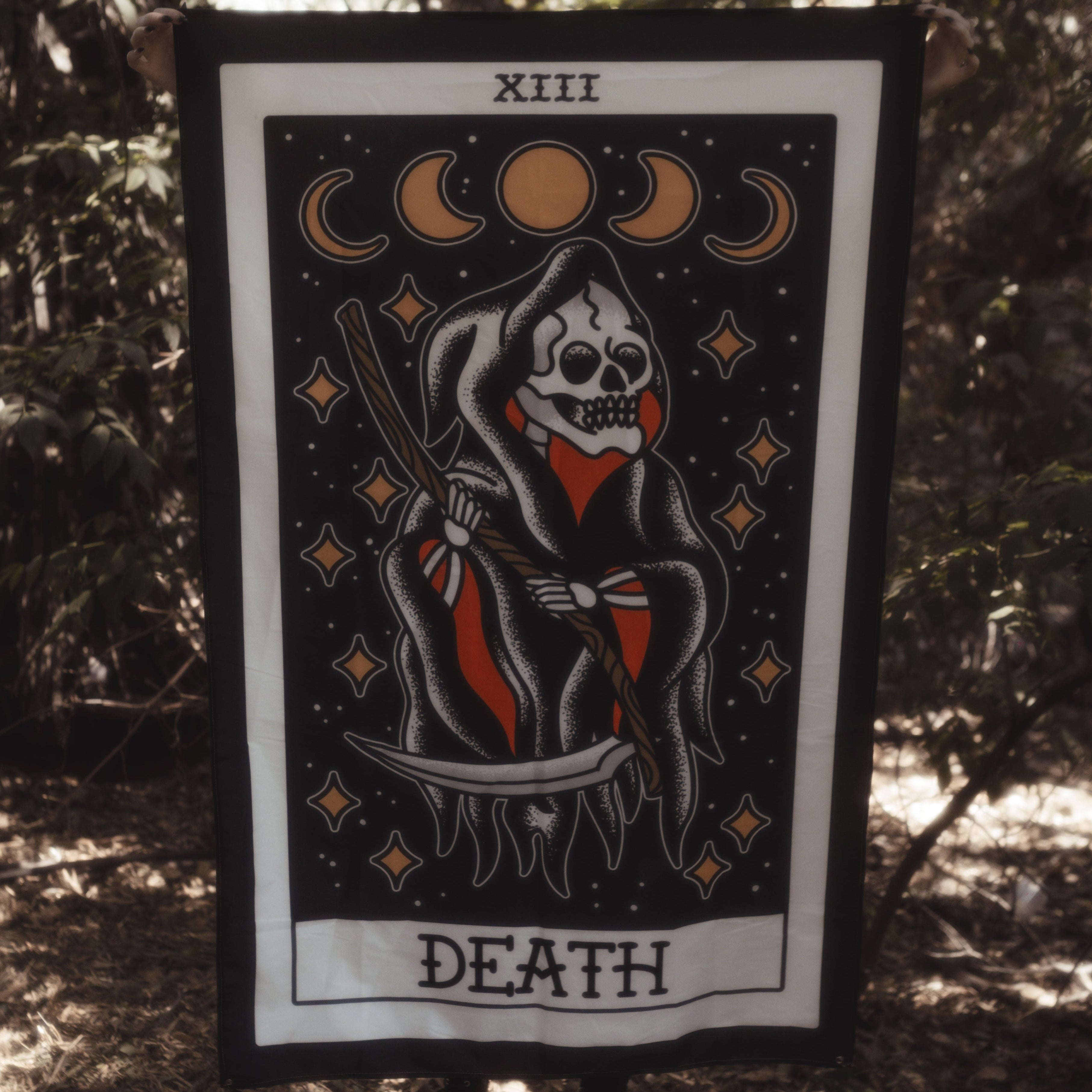 Death Tarot card tapestry being held up