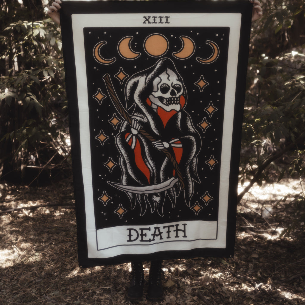 Death Tarot card tapestry being held up