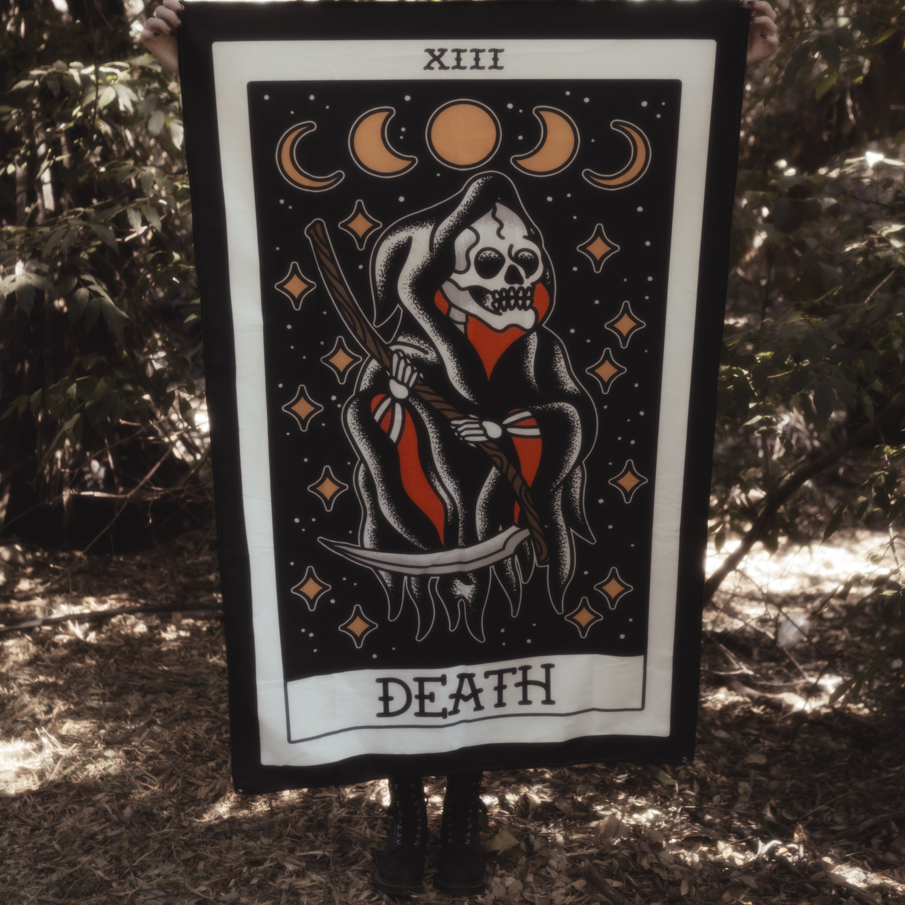 Death Tarot card tapestry being held up