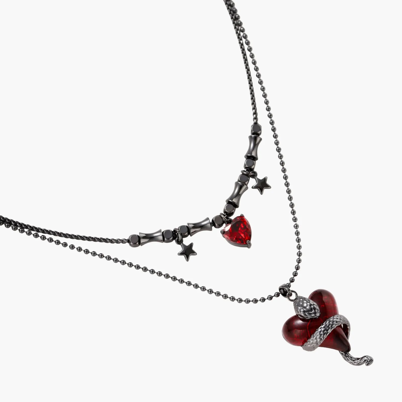 Necklace with red heart pendants and star accents on a white background