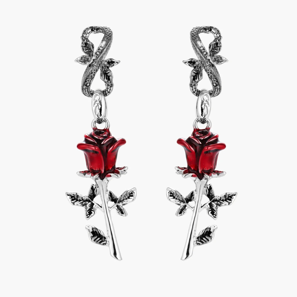 Pair of earrings with red rose and silver leaves on a white background