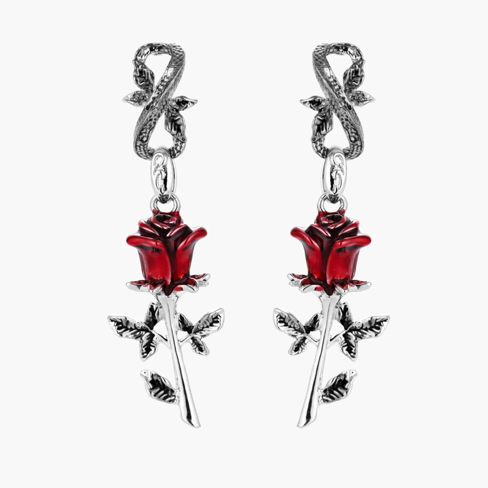 Pair of earrings with red rose and silver leaves on a white background