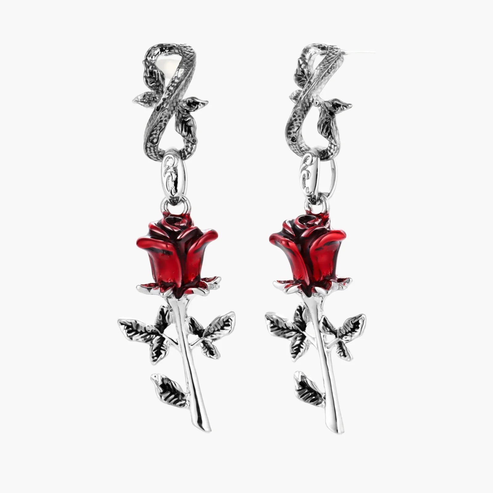Pair of earrings with red rose designs on a white background