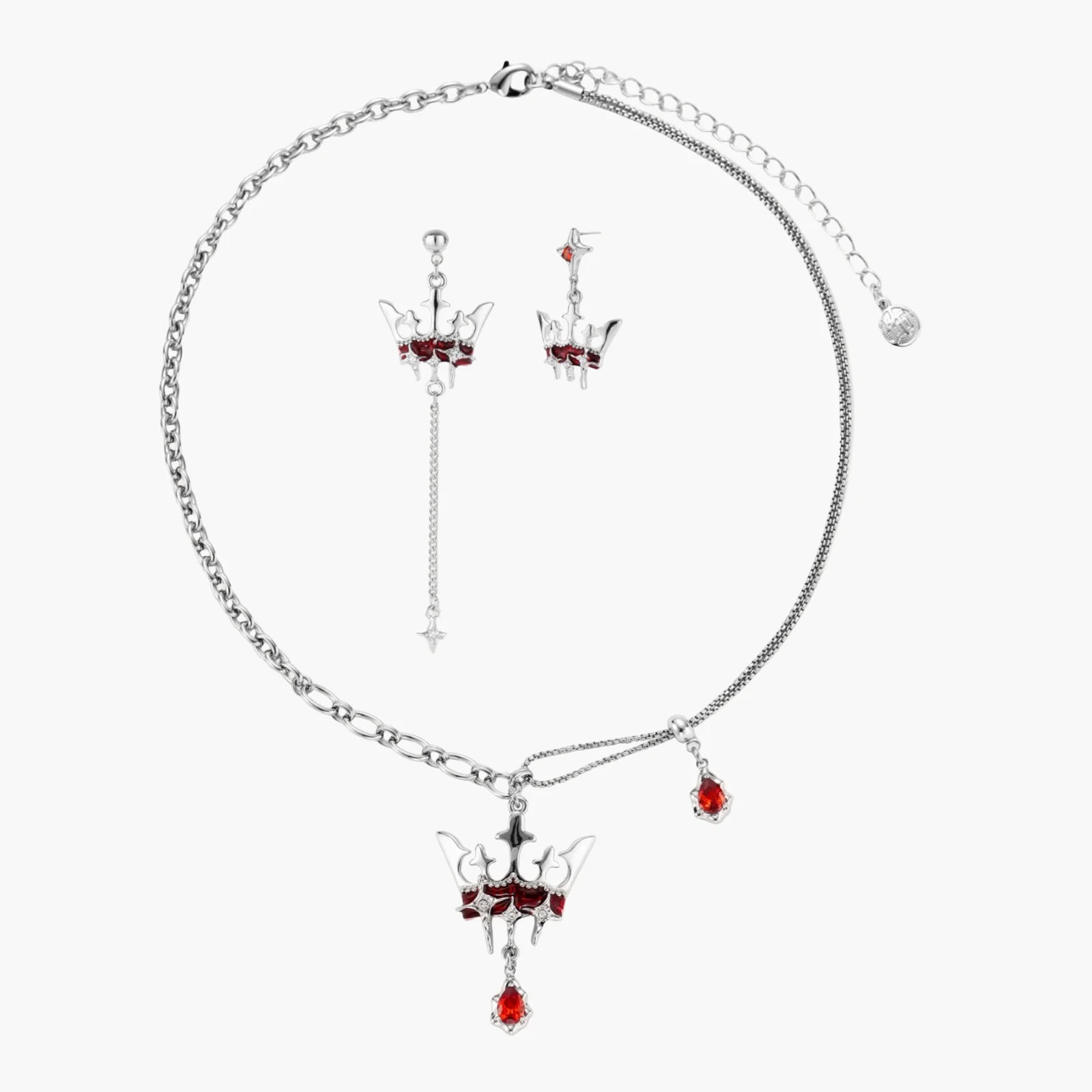 Silver necklace with red gemstones on a white background