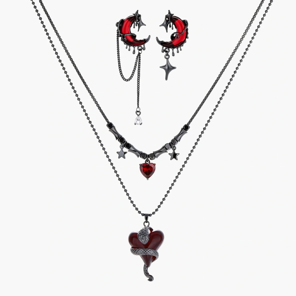 Necklace with heart-shaped pendant and earrings on a white background
