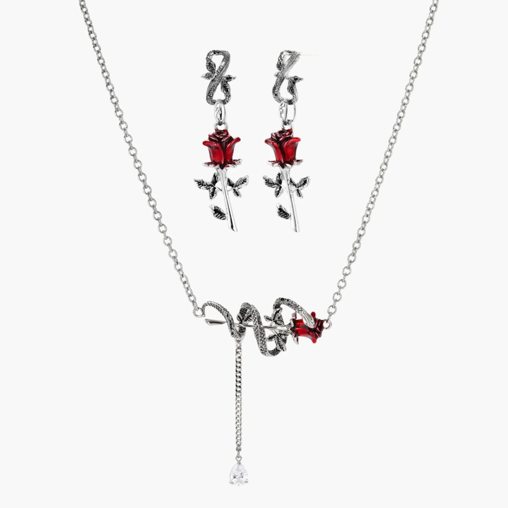 Jewelry set with necklace and earrings featuring red rose designs on a white background