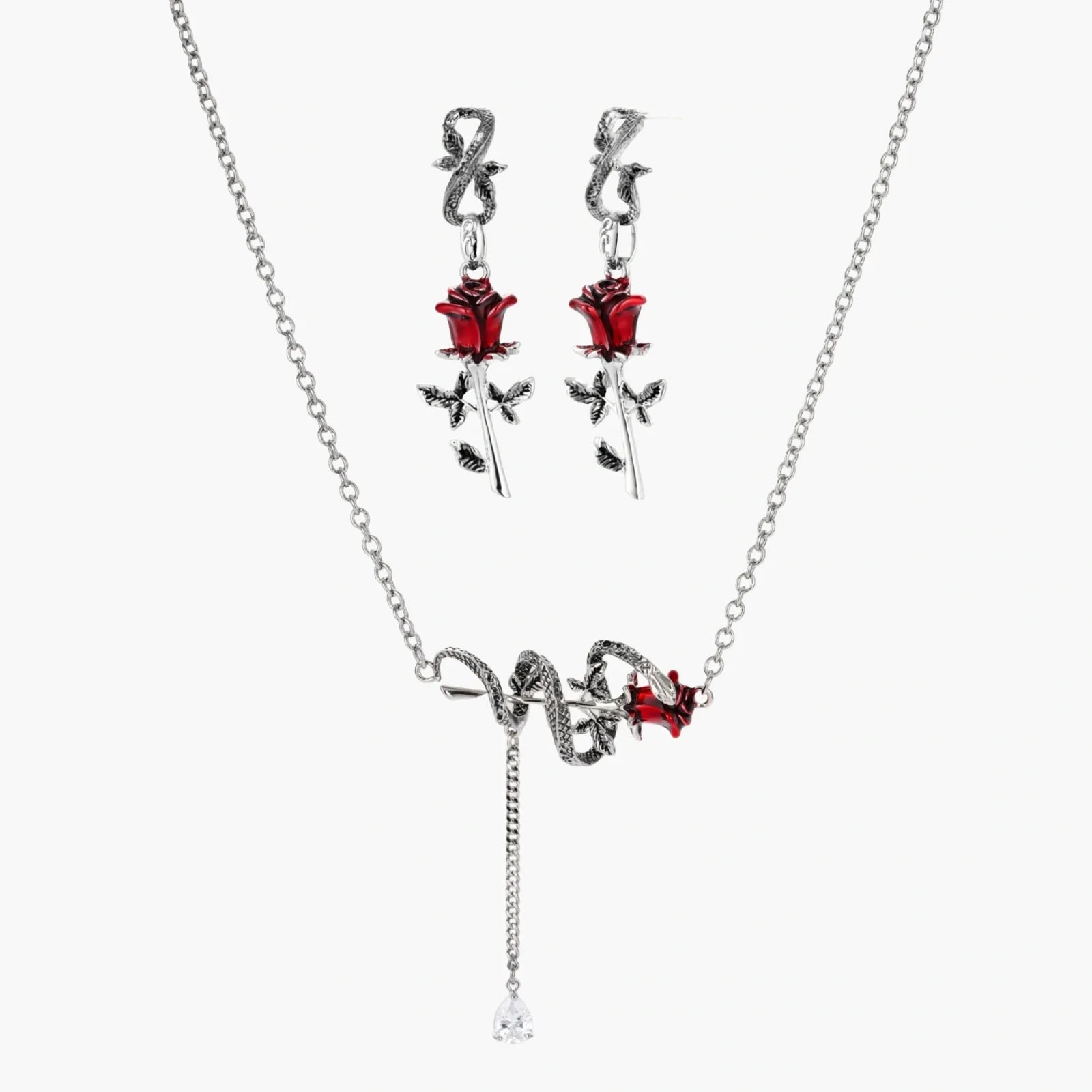 Jewelry set with necklace and earrings featuring red rose designs on a white background