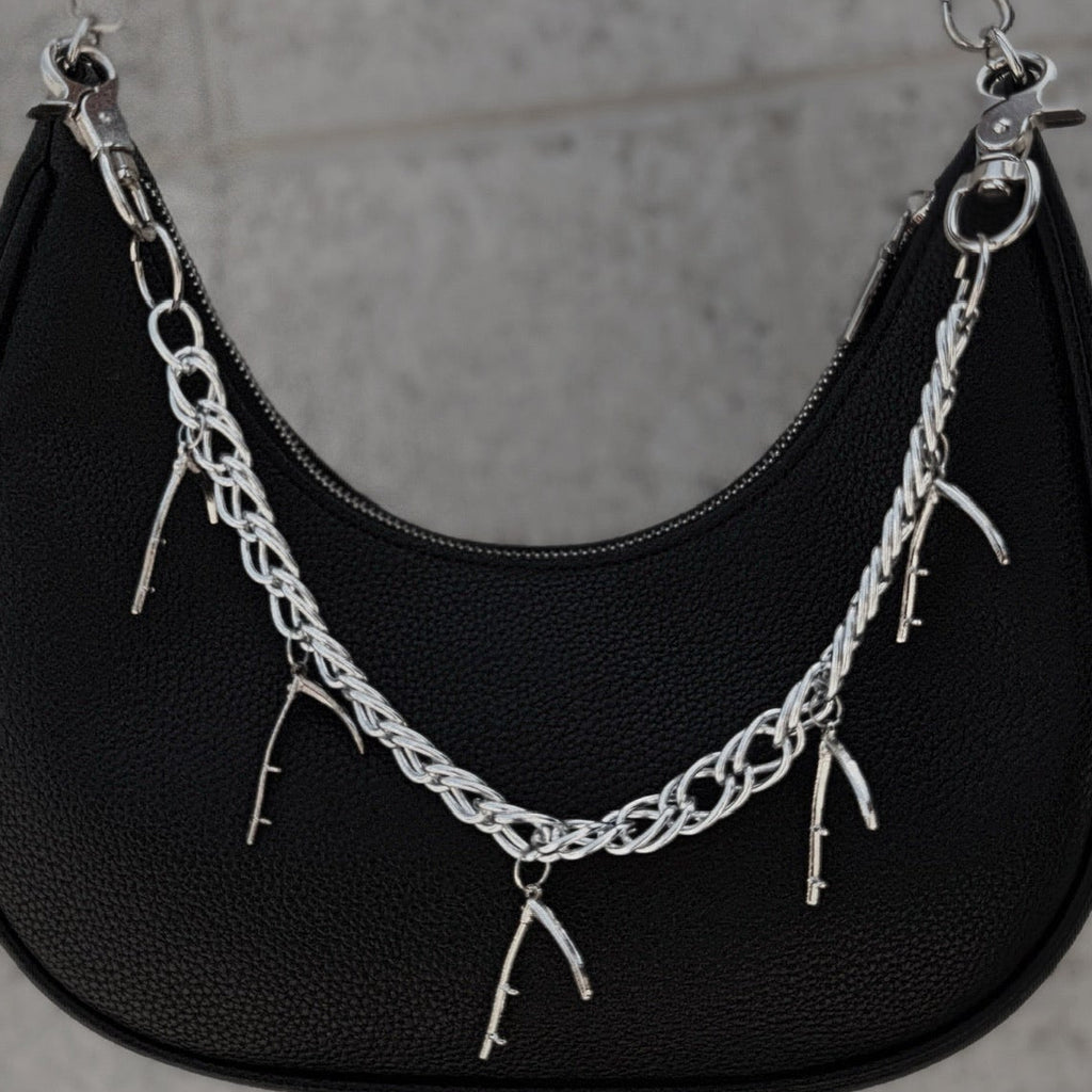 Chain with hanging scythes.