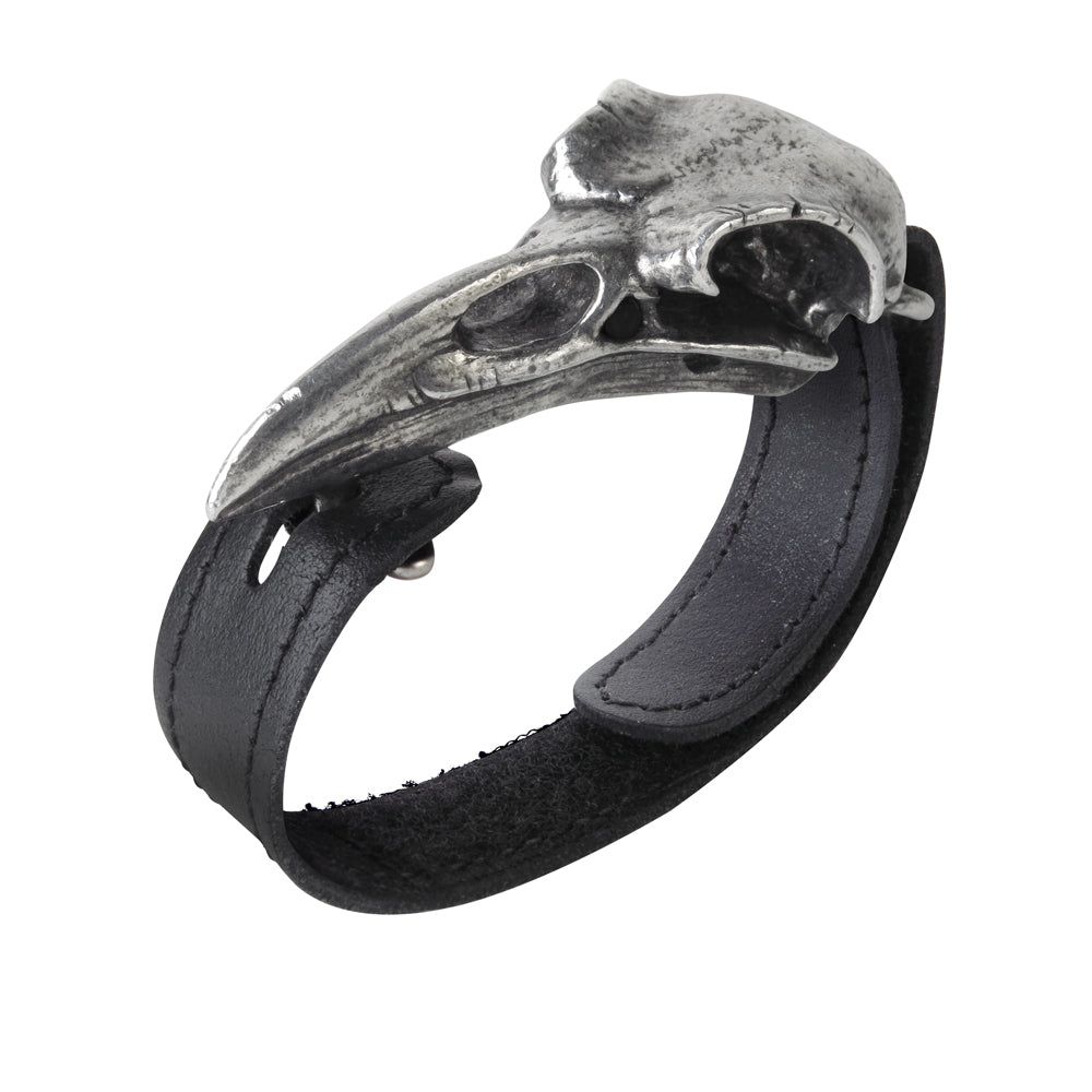 Black leather bracelet with silver skull design on a white background