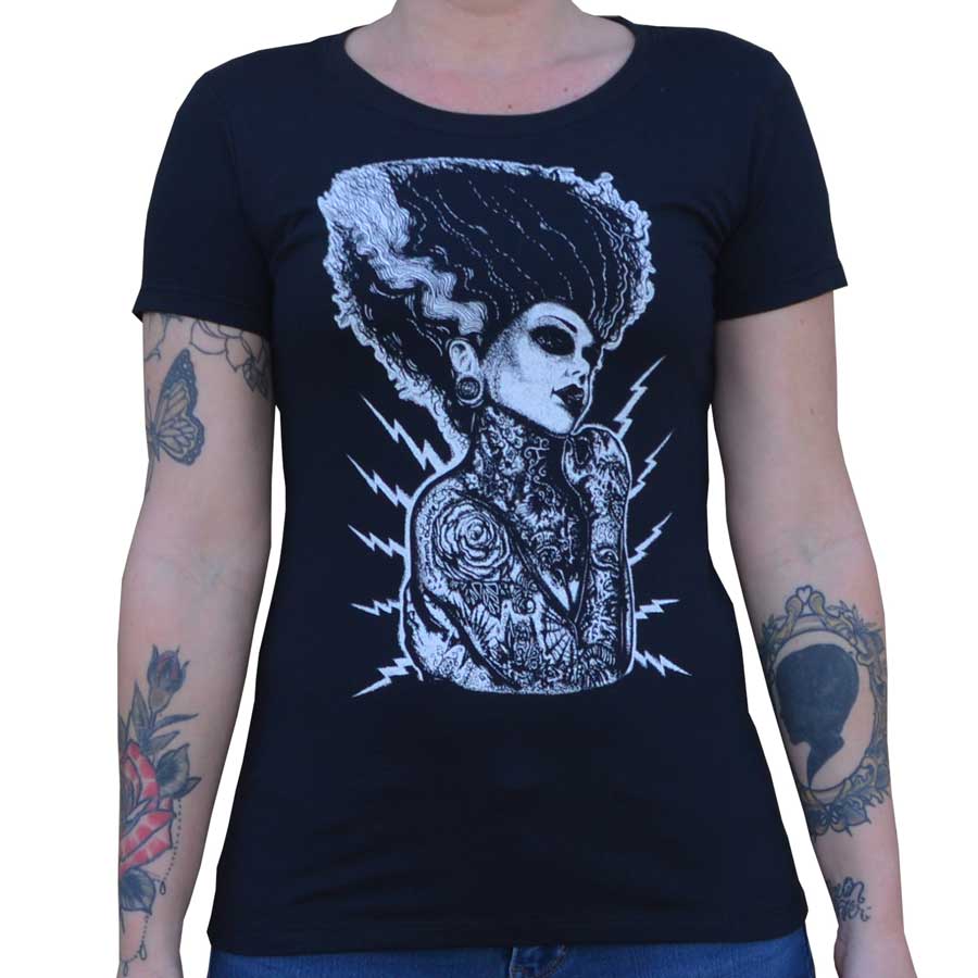 Black t-shirt with a white graphic design of a woman's face and tattoos on a plain background