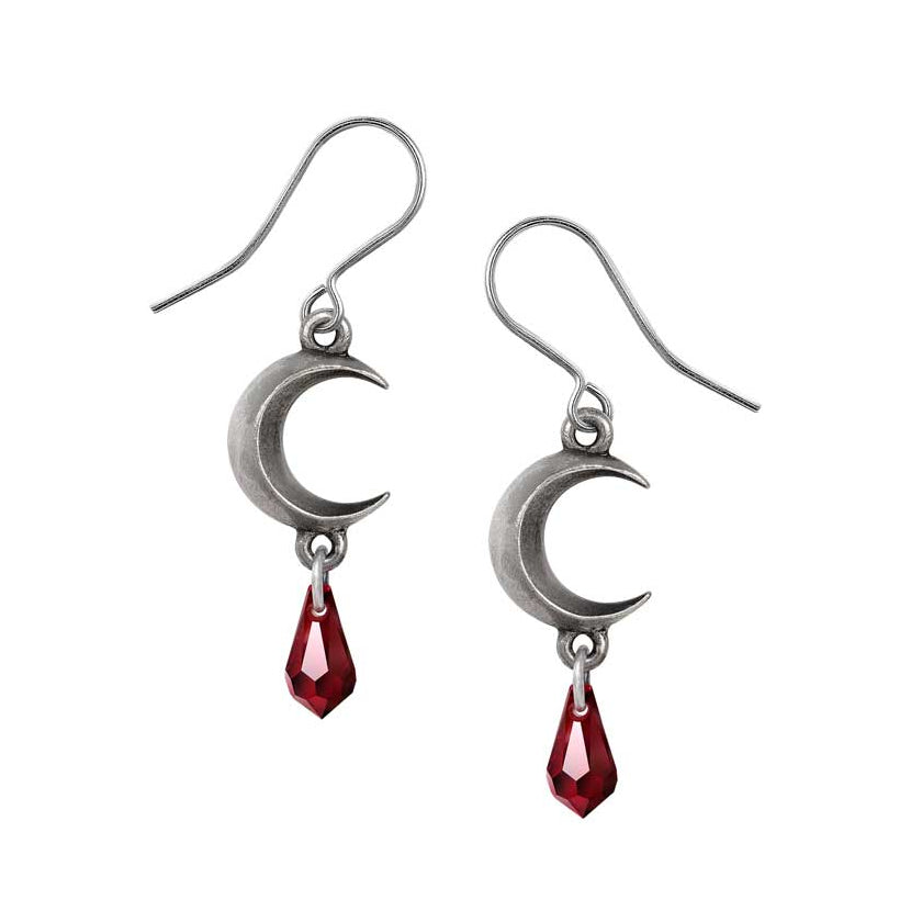 Silver moon-shaped earrings with red teardrop charms on a white background