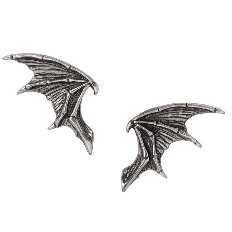 A pair of silver-toned metal wing-shaped stud earrings with detailed textured ridges, shown on a plain white background.