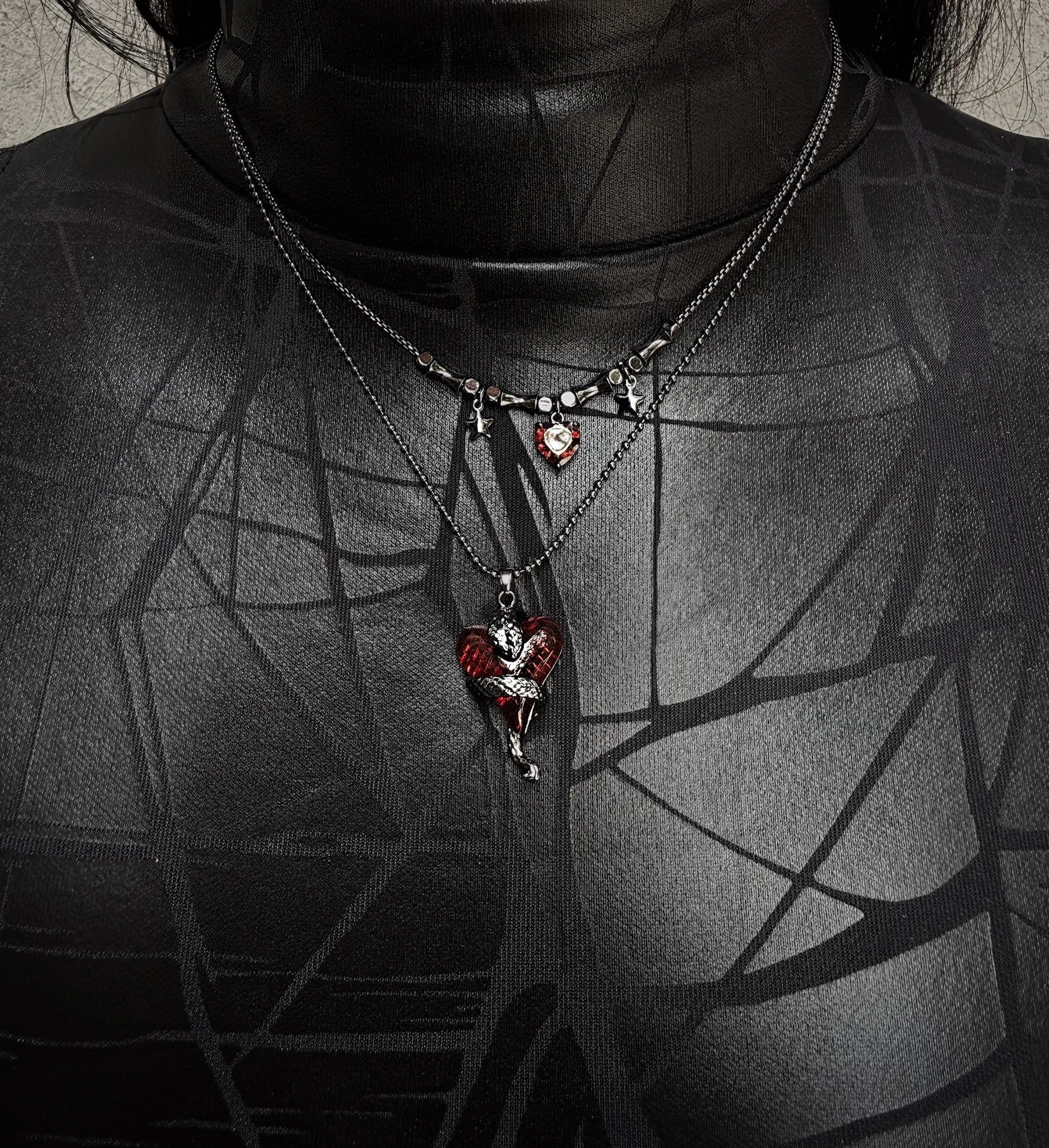 Necklace with heart-shaped pendants on a dark background