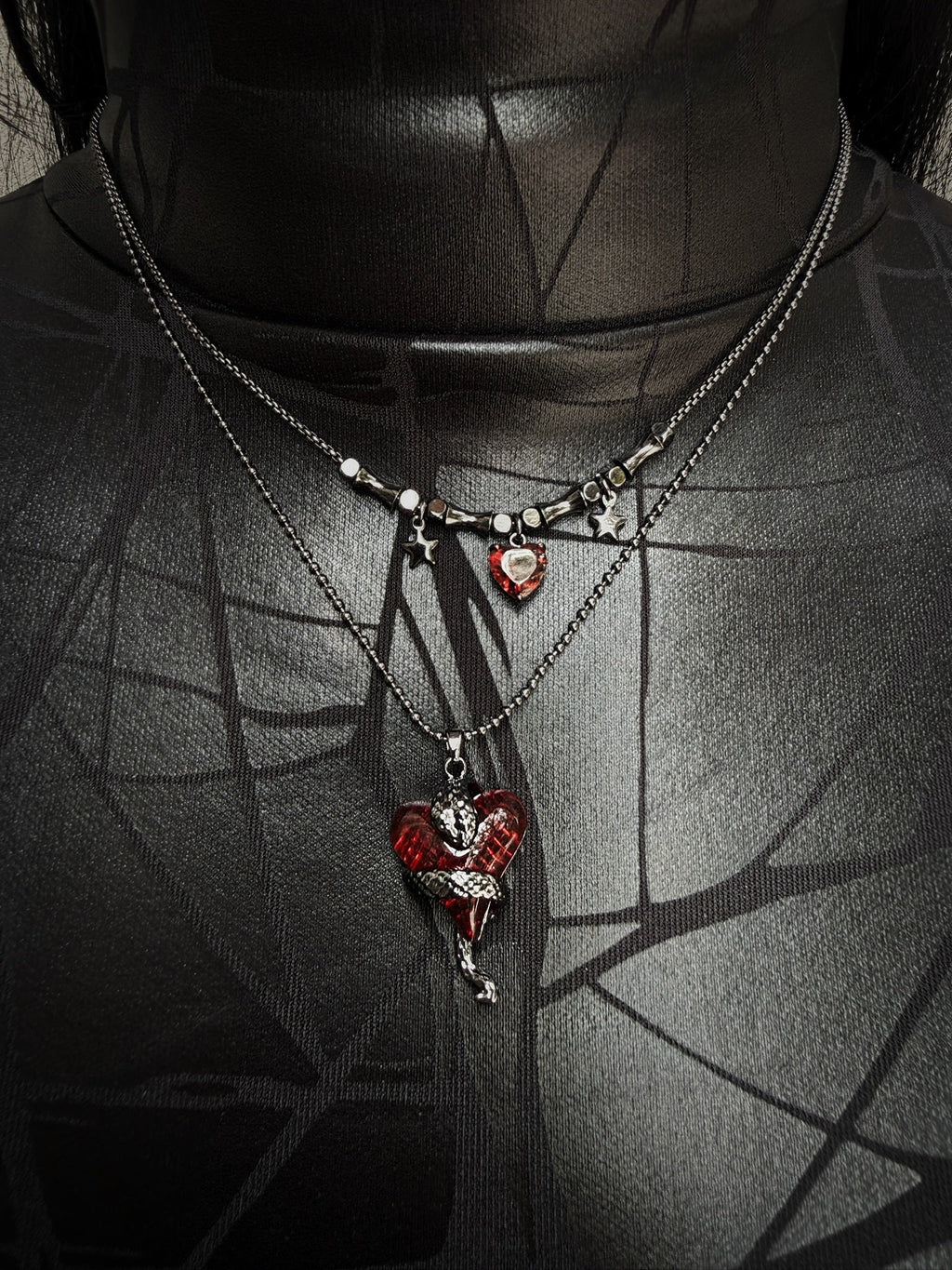 Necklace with heart-shaped pendants on a dark background