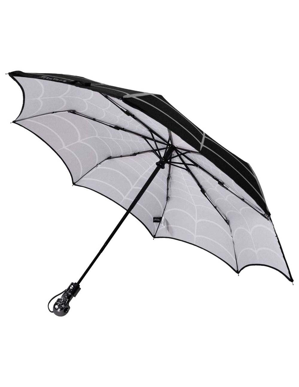Black and white umbrella with spider web pattern on a white background