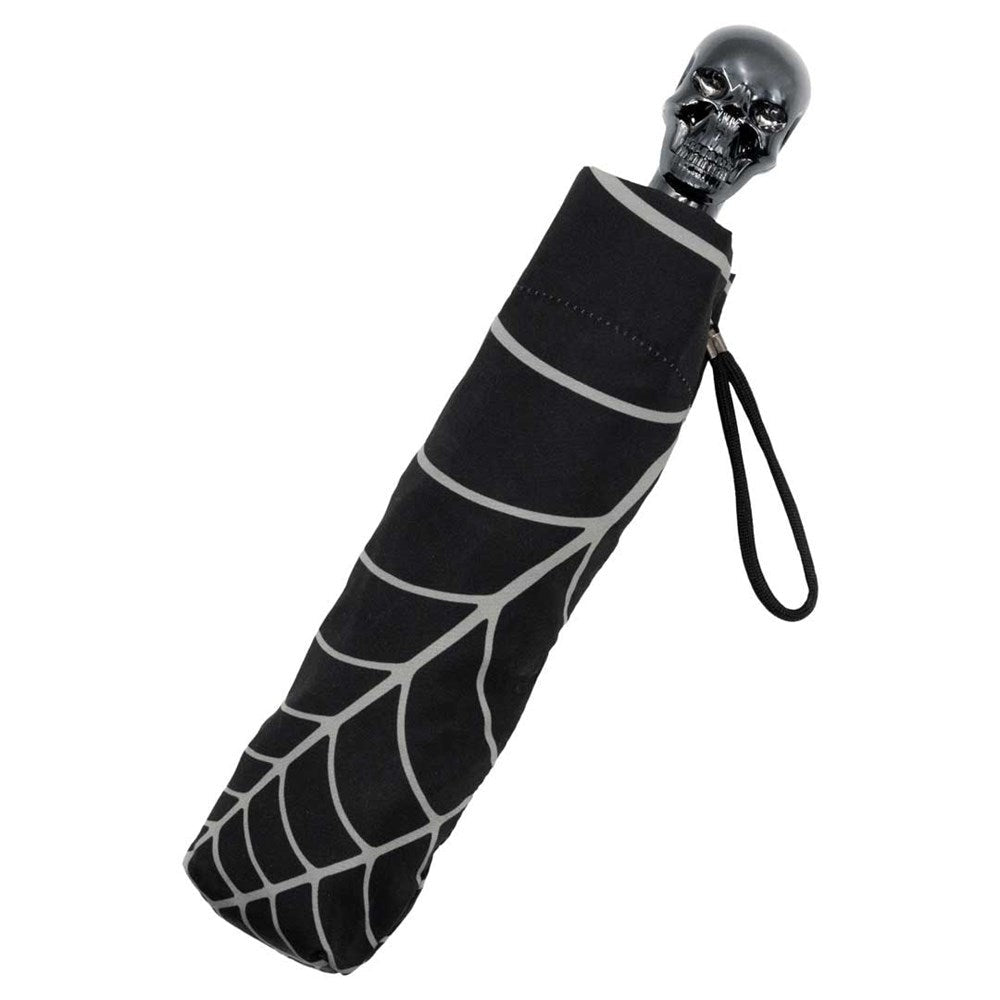 Black umbrella with spider web pattern and skull handle on a white background