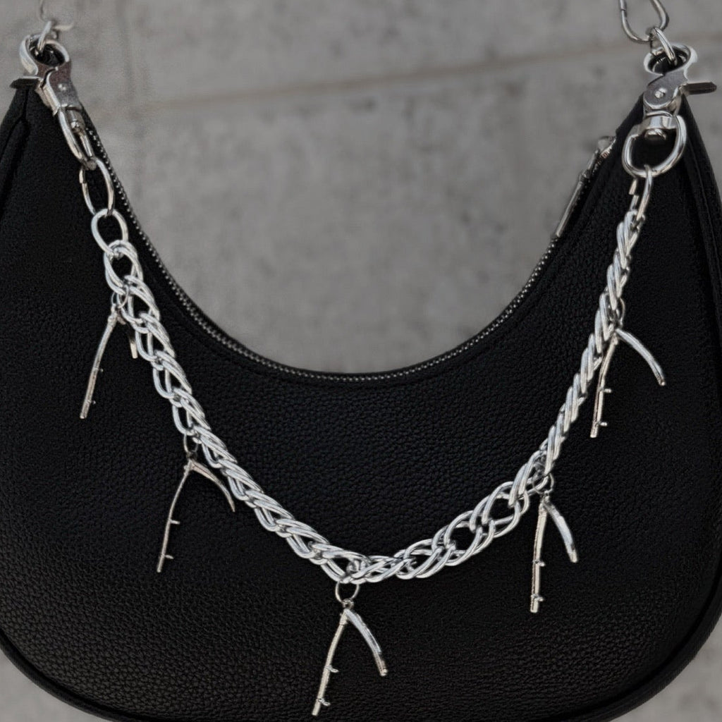 Chain with hanging scythes.