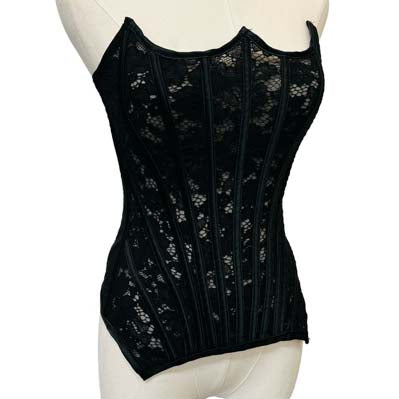 Black lace corset on a mannequin against a white background