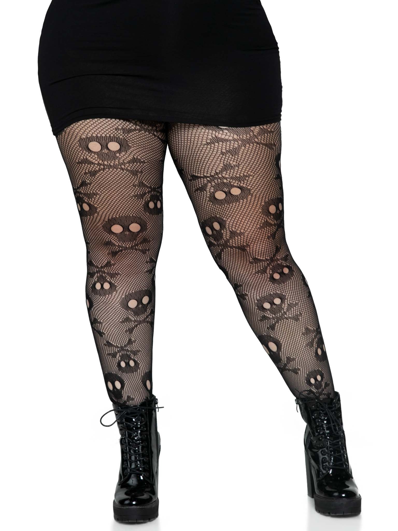 Black fishnet tights with skull design worn by a person on a white background