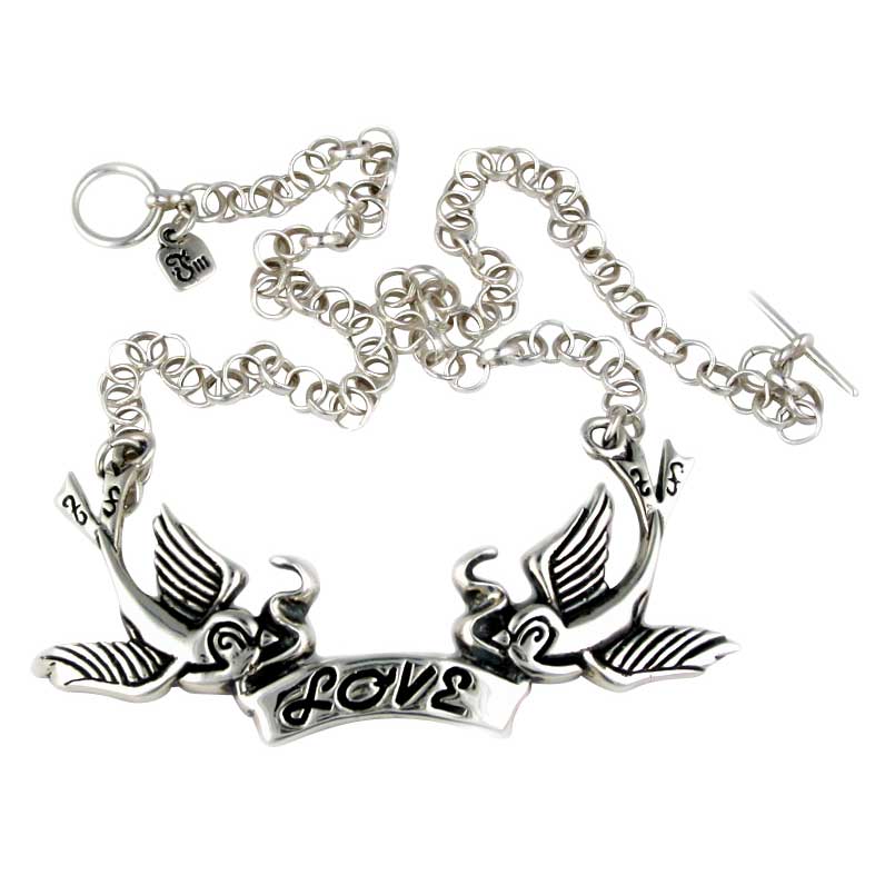 Silver necklace with 'love' and winged design on a white background