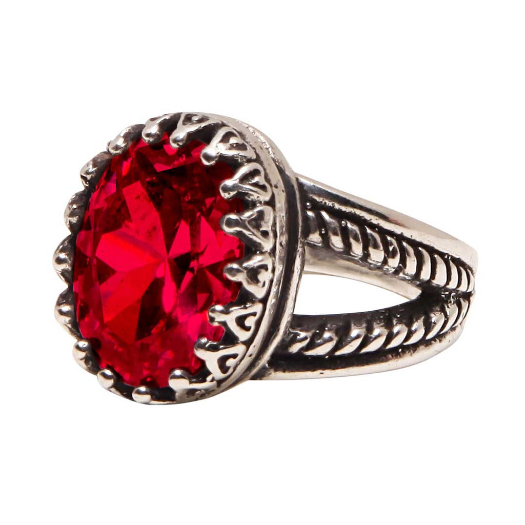 Silver ring with a large red gemstone on a white background