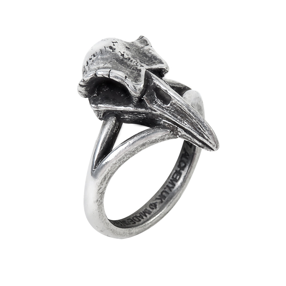 Silver ring with intricate design on a white background