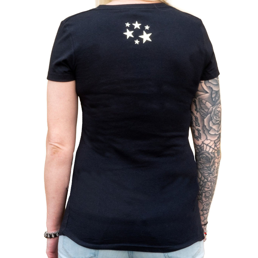 Person wearing a black t-shirt with white star design on the back, standing against a white background.
