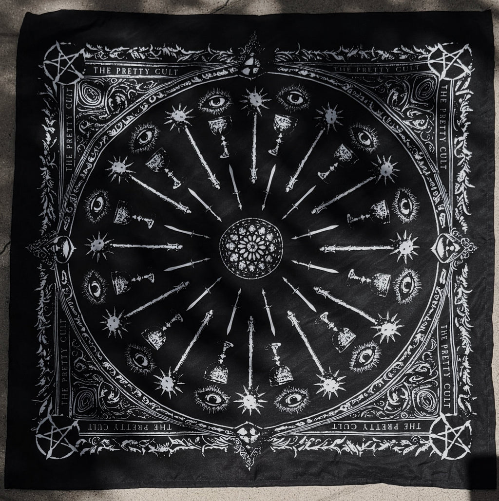 Black scarf with white symbols and designs on a dark background