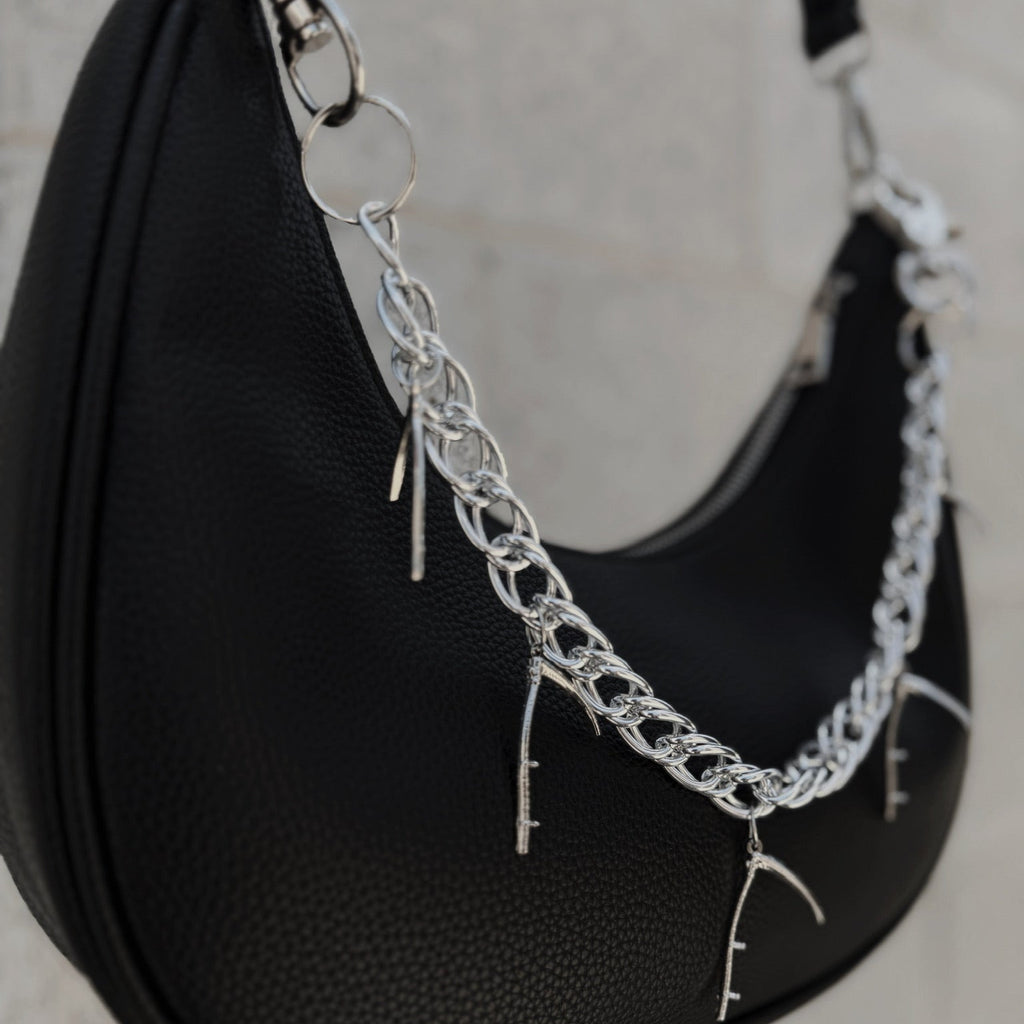 Chain with hanging scythes.