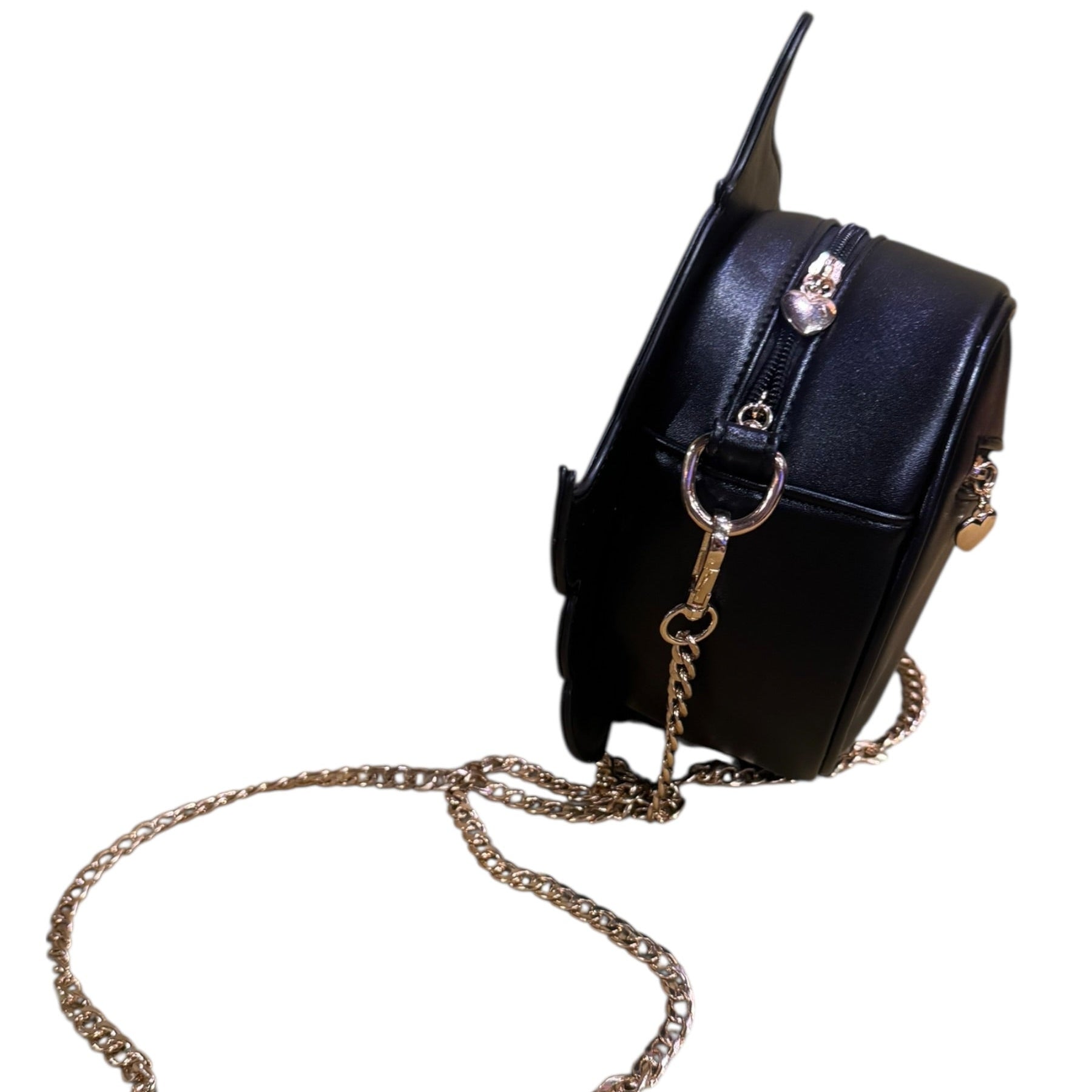Black handbag with a gold chain strap on a white background