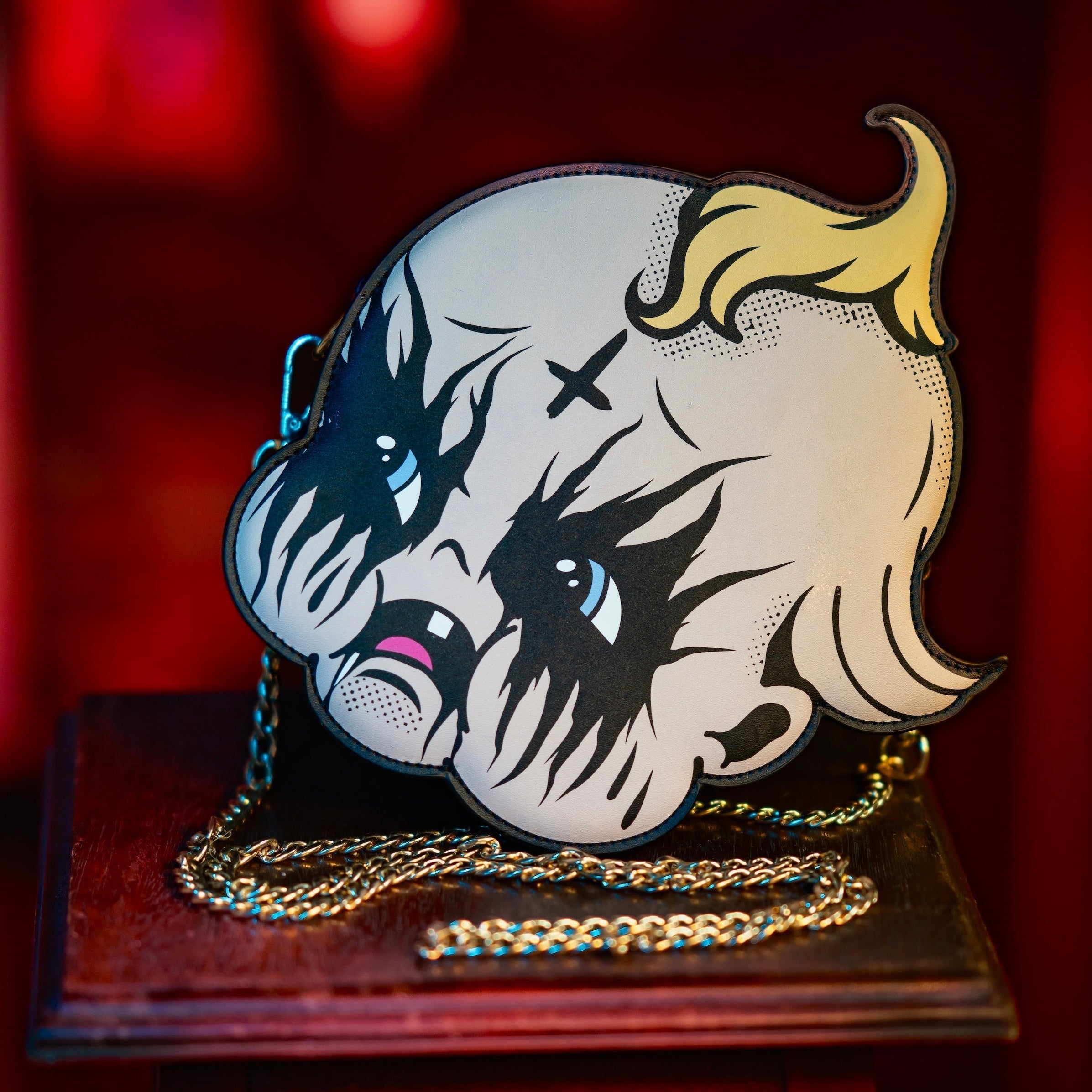 Artistic depiction of a face with stylized hair on a stand against a red background