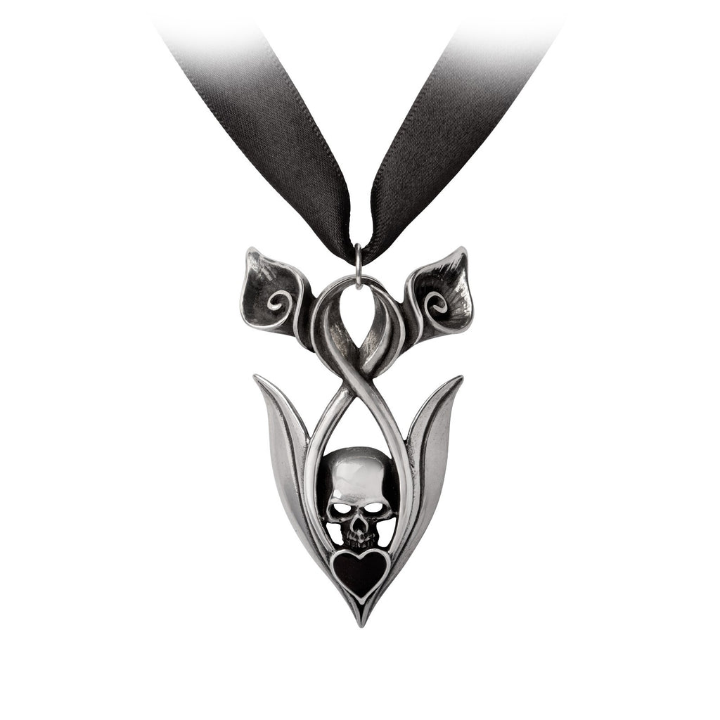 Pendant with skull design on a black ribbon against a white background