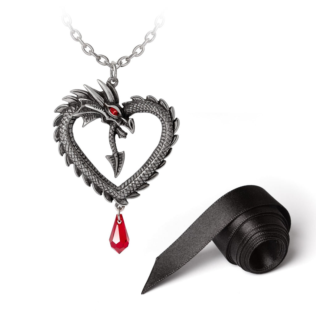 Dragon-shaped necklace with a red gem and black ribbon on a white background