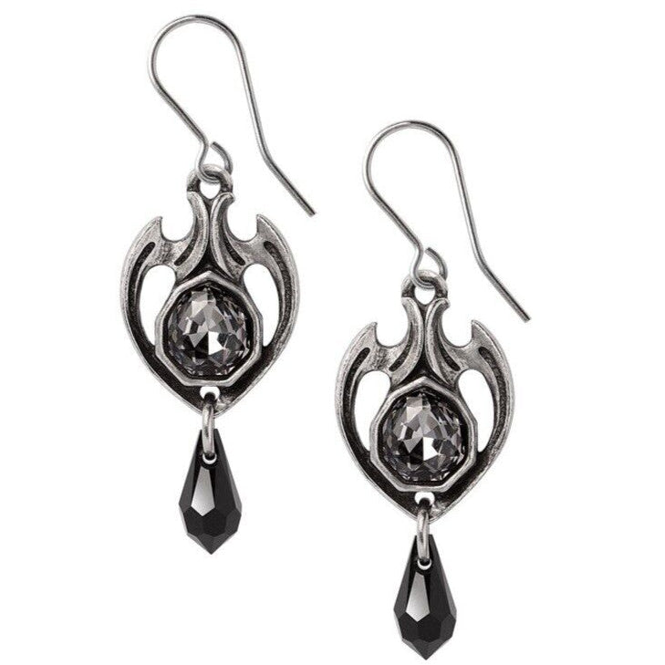Pair of silver earrings with black teardrop stones on a white background