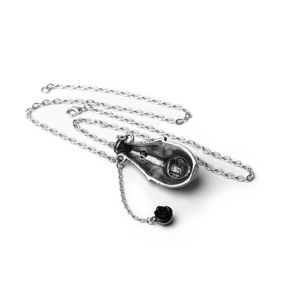 Silver necklace with a pendant and black rose on a white background