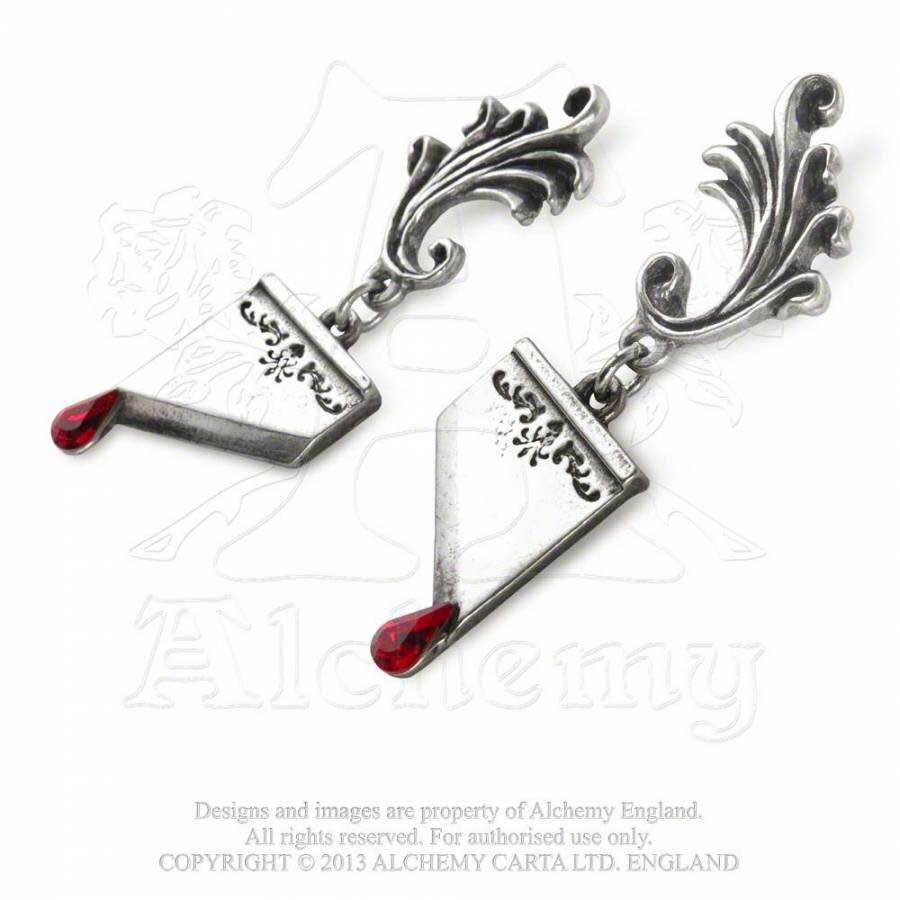 Pair of silver earrings with red gemstones on a white background, branded with Alchemy England.