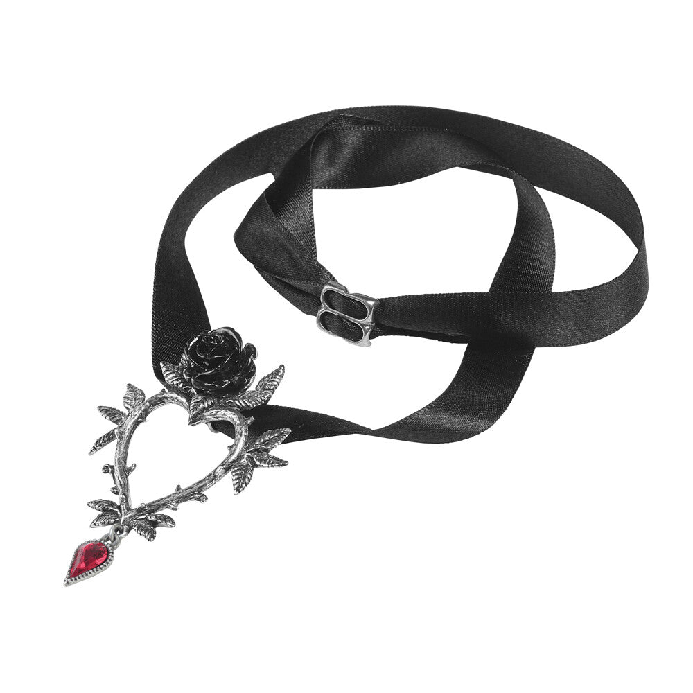 Black ribbon with a decorative heart-shaped pendant featuring a rose and red gemstones on a white background.