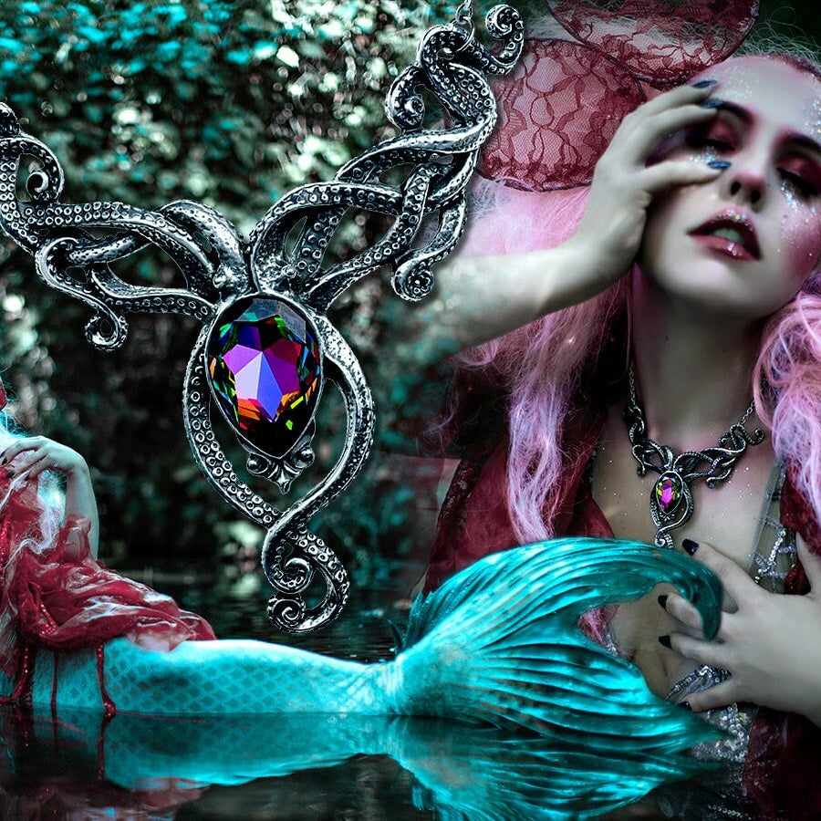 Mermaid with pink hair and blue tail in a forest setting, surrounded by mystical elements.
