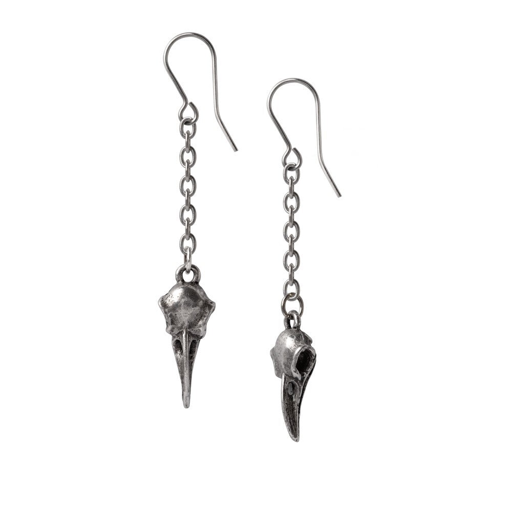 Pair of silver bird skull earrings on a white background
