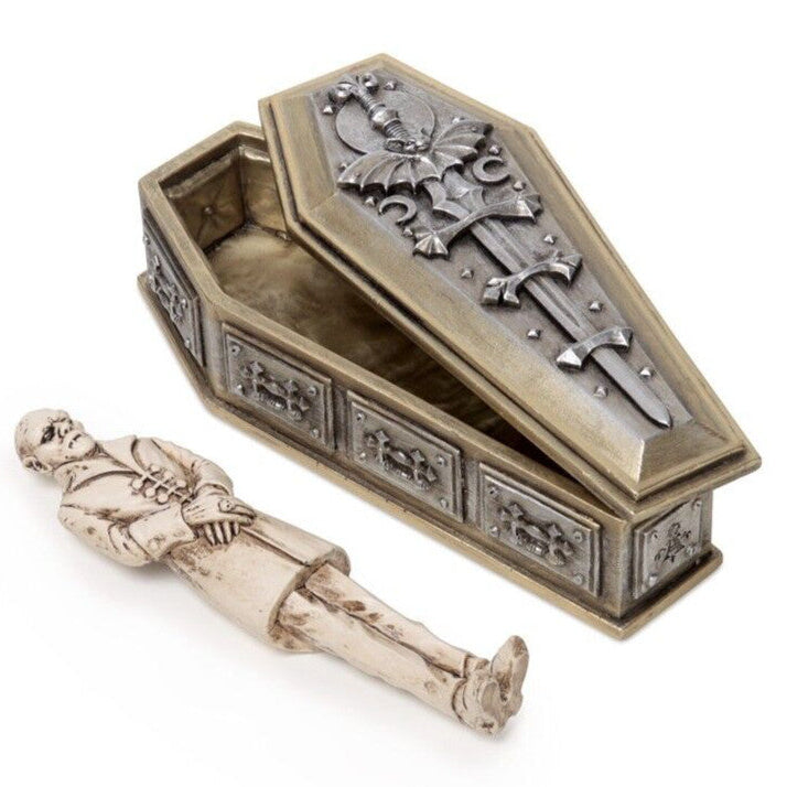 Decorative coffin with skeleton figure on a white background