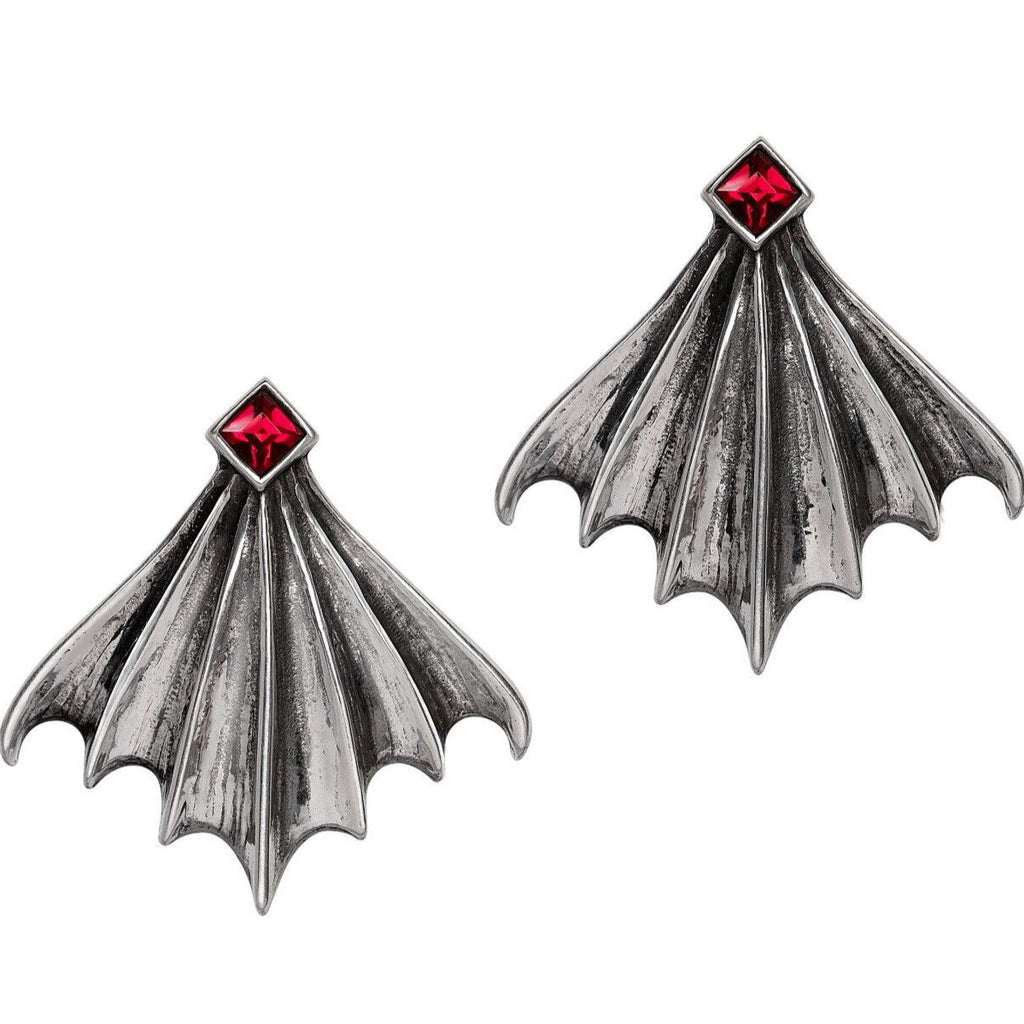 Gothic-style bat wing earrings with red gemstones on a white background