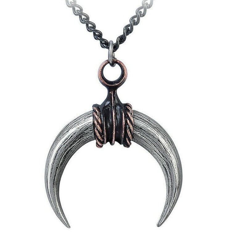 Necklace with a unique pendant featuring two curved blades and a small circular element.