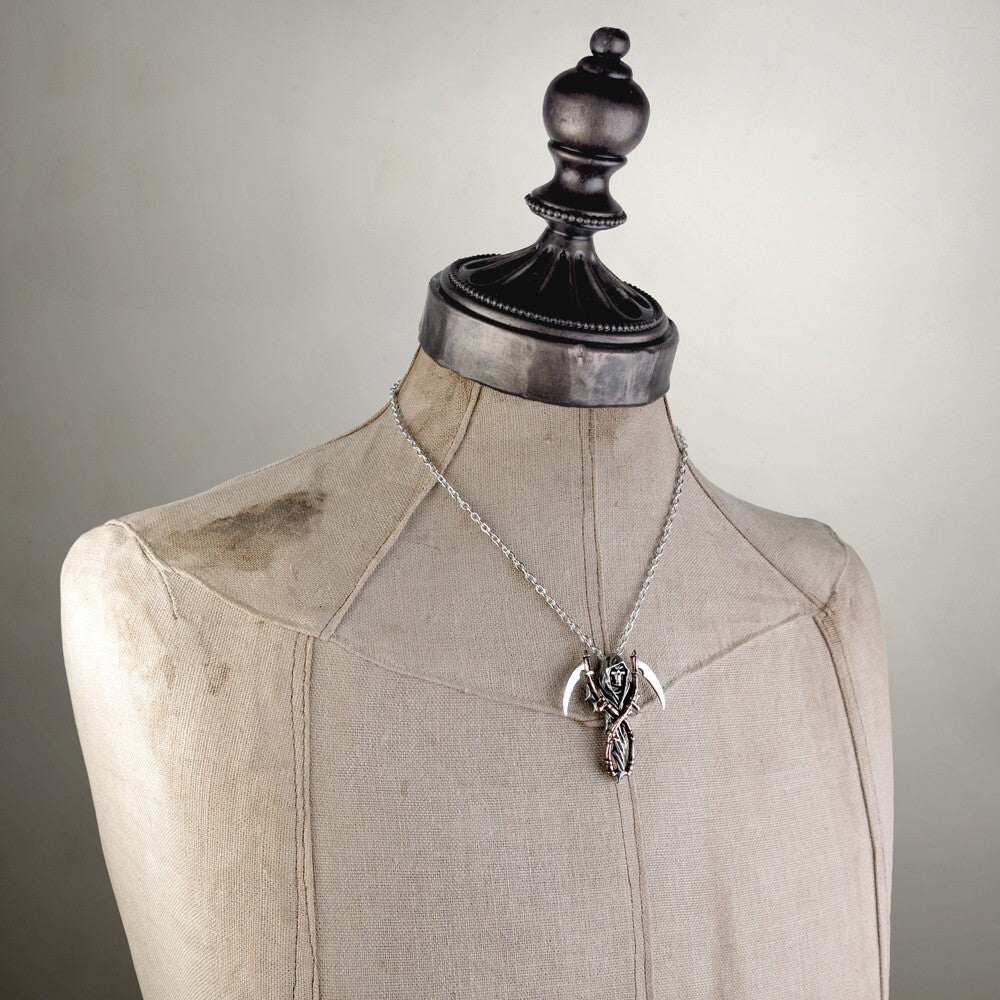 Necklace with a pendant on a mannequin bust against a neutral background
